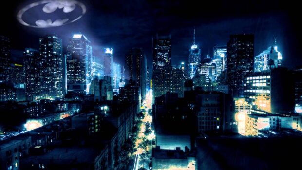 Gotham skyline viewed at night with bright city lights and illuminated skyscrapers