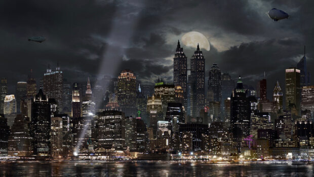 Night view of Gotham skyline illuminated under a full moon with bright city lights and airships