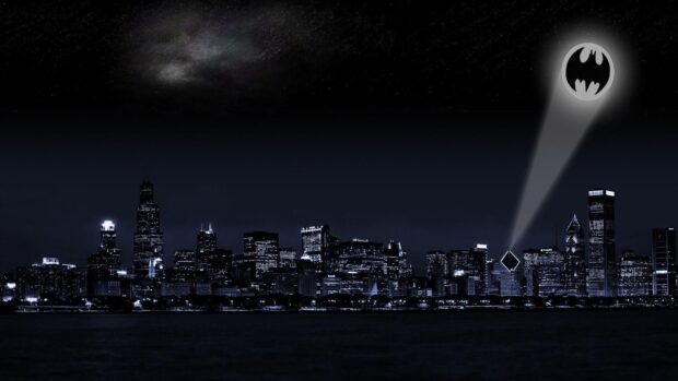 Gotham skyline at night with a bright Bat signal shining over the cityscape