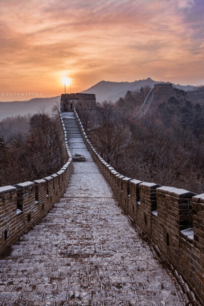 Snow dusted section of the Great Wall of China at sunrise