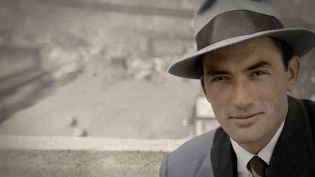 Gregory Peck in a vintage hat and suit with a calm expression, 4K Desktop Wallpaper