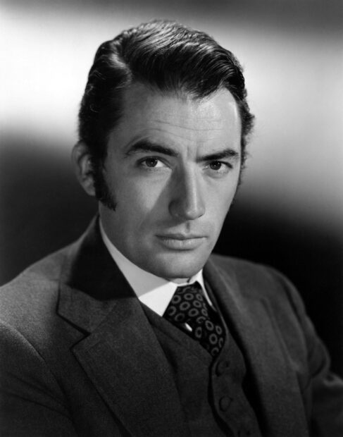 A classic black and white portrait of Gregory Peck wearing a suit and tie, 2K Desktop Wallpaper