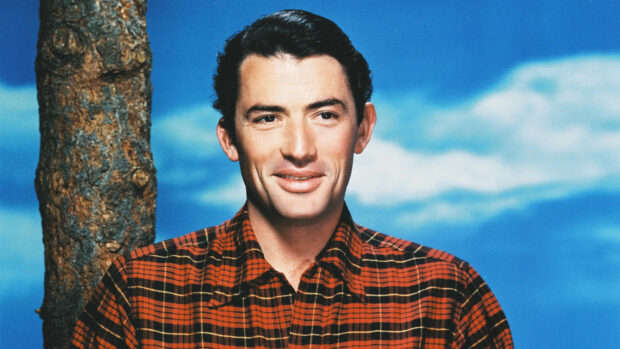 Gregory Peck smiles wearing a red plaid shirt with a blue sky background, HD Desktop Wallpaper