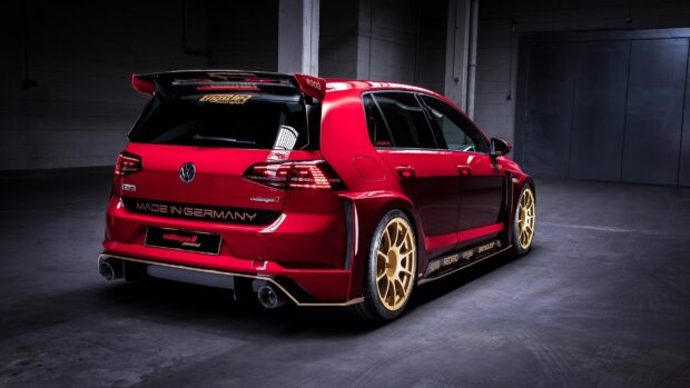 Red Gti parked inside a garage with golden wheels and sporty modifications