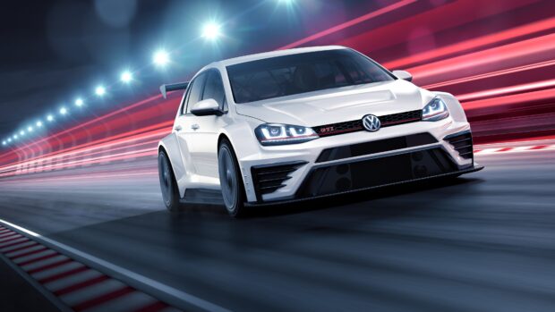 White Volkswagen GTI car racing on a track at high speed under bright lights