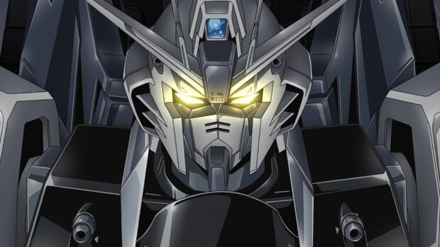 Close up of Gundam head with glowing yellow eyes in dark setting