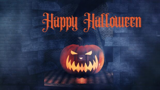 A scary jack o' lantern glows in the dark for a spooky Halloween 2025