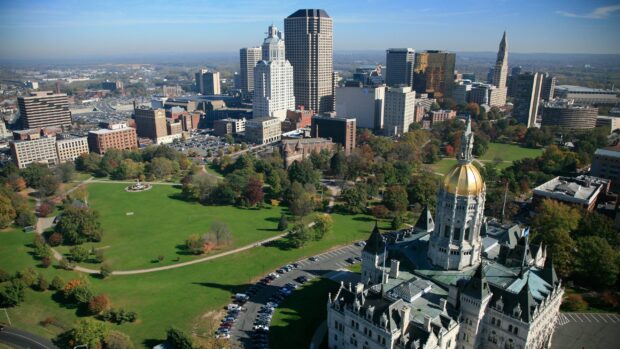 Aerial view of Hartford skyline featuring historic architecture and green parks in the city center