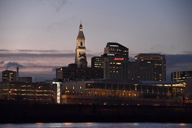 Hartford skyline with illuminated buildings and a tower at dusk in Hartford