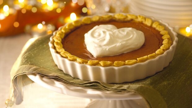 The pie with a heart shaped whipped cream topping sits on a decorative cloth, HD Desktop Wallpaper