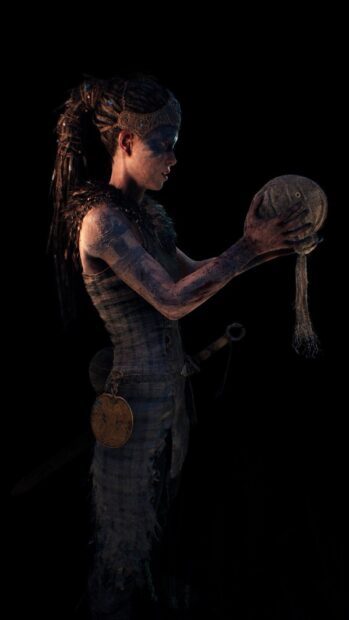 A female warrior from Hellblade Wallpapers examines a mystical artifact in her hands, HD Phone Wallpaper