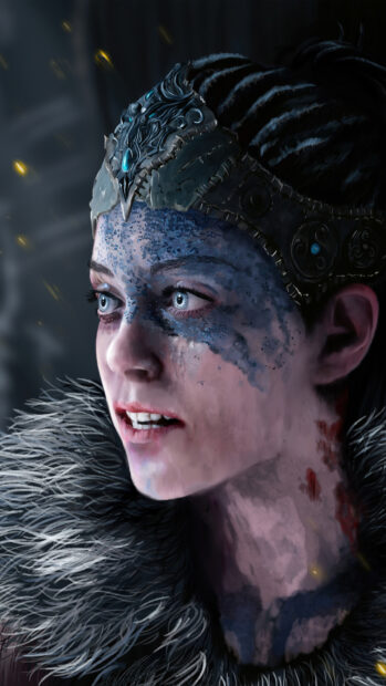 A close up of a female warrior with detailed face paint and armor from Hellblade HD Phone Wallpaper