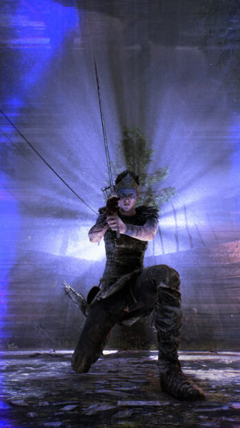 A Hellblade warrior kneels holding a sword with light rays shining behind her, HD Mobile Wallpaper