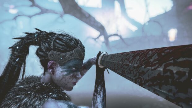 A fierce warrior prepares to strike with her sword in this Hellblade Wallpapers scene, 4K Desktop Wallpaper