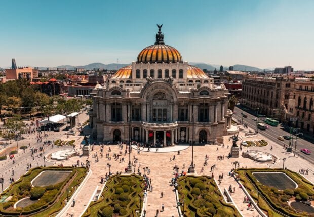 The Palacio de Bellas Artes stands prominently in Mexico City with people in the plaza, Mexico City Wallpapers, 2K Desktop Wallpaper