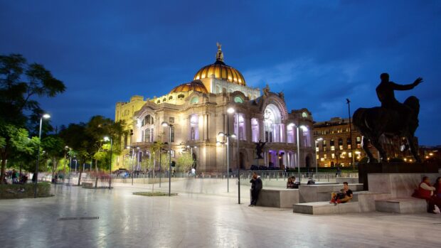 The Palacio de Bellas Artes illuminated at night in Mexico City shows its architectural beauty, 2K Desktop Wallpaper
