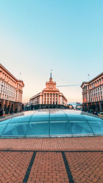 A glass dome with historic buildings in Bulgaria city under a clear sky, HD Mobile Wallpaper