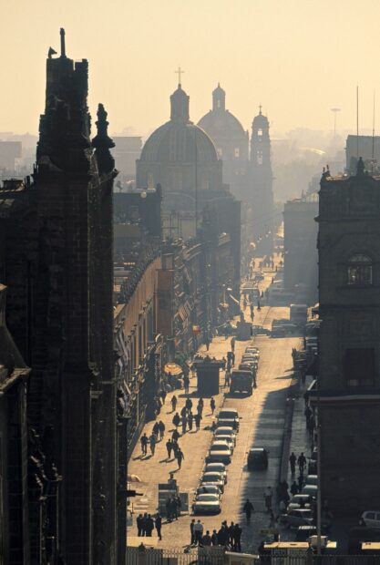 The street in Mexico City shows historic buildings and people walking with domes in the background, HD Mobile Wallpaper
