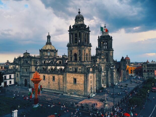 The historic cathedral stands prominently in this Mexico City scene with the national flag waving, HD Desktop Wallpaper