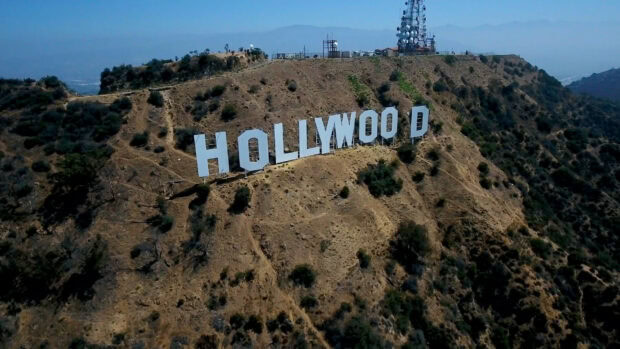 Aerial view of Hollywood sign on a dry hillside with natural surroundings