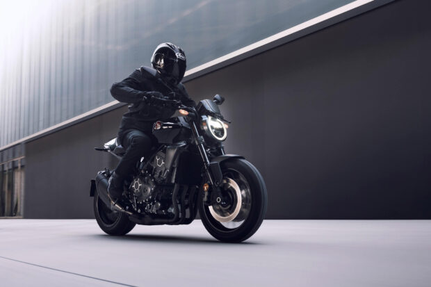 A rider on a Honda CB1000R moving in a modern city environment, HD Desktop Wallpaper
