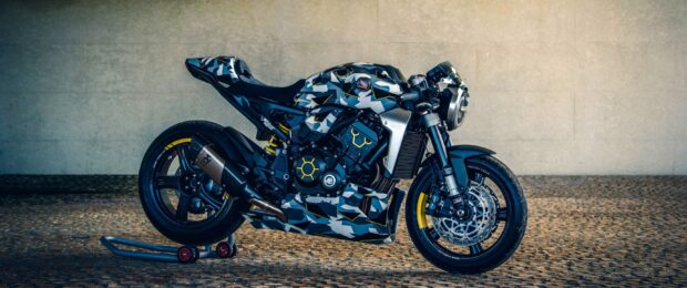 A Honda Cb1000R with a blue and gray camo pattern is parked on a cobblestone floor, 2K Desktop Wallpaper