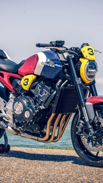 A Honda Cb1000R motorcycle with a custom blue and red paint design by the seaside, HD Phone Wallpaper