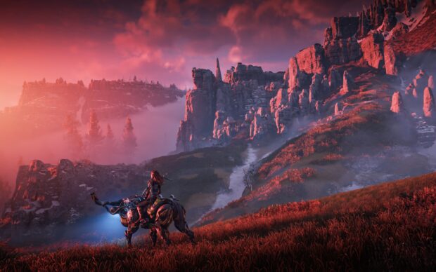 Horizon Forbidden West landscape with a character riding a mechanical creature through rocky terrain