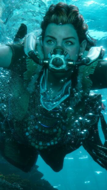 Aloy exploring underwater in Horizon Forbidden West with advanced breathing gear