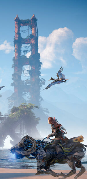 Aloy riding a robotic creature near a tower covered in vegetation in Horizon Forbidden West