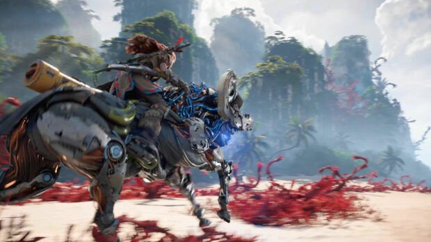 Horizon Forbidden West character riding a machine in a lush environment with red vegetation and mountains