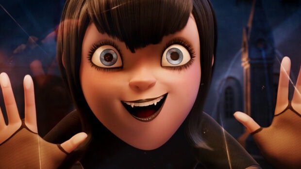 A close up of a character from Hotel Transylvania with bright blue eyes and a happy expression