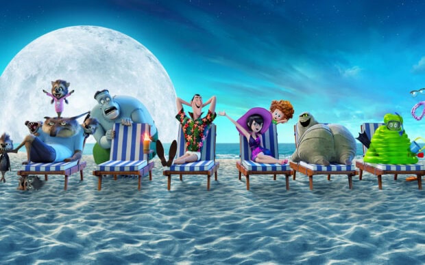 Hotel Transylvania characters relaxing on beach chairs under a large full moon at night