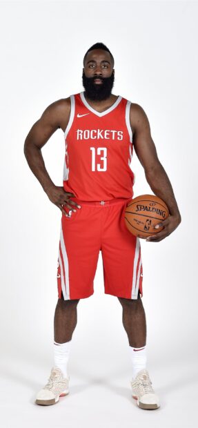 James Harden in Houston Rockets uniform holding a basketball in a studio setting