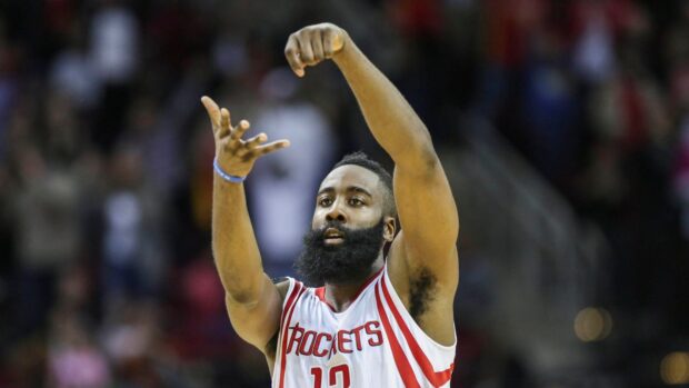 Houston Rockets player shooting a basketball during the game in a Rockets jersey