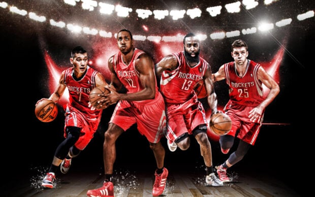 Four Houston Rockets players in action during a basketball game on the court