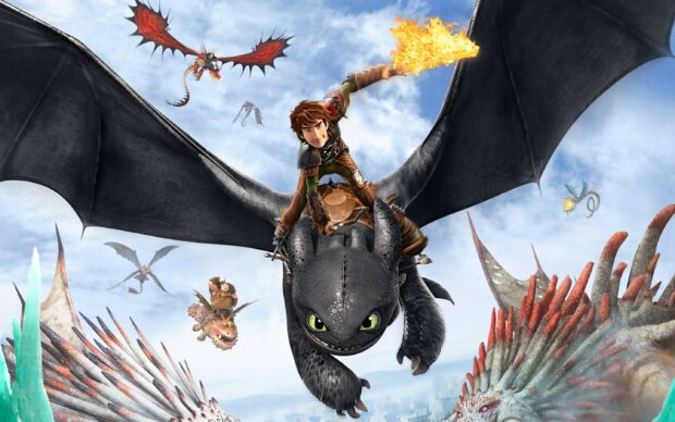 Hiccup riding a dragon breathing fire in the sky from How To Train Your Dragon