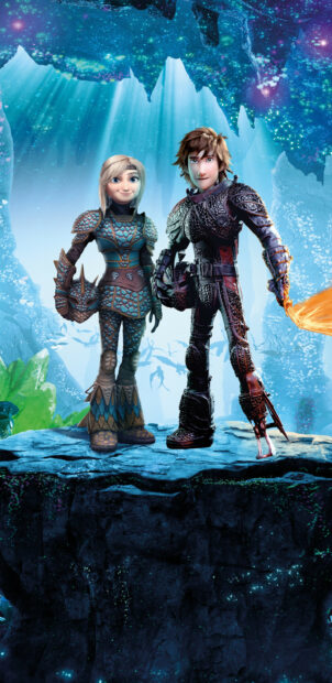 Female and male characters from How To Train Your Dragon standing on a cliff in dragon armor