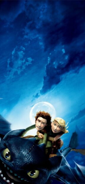 Hiccup and Astrid riding a dragon under the moon in How To Train Your Dragon