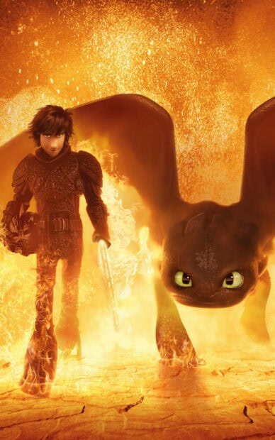 Hiccup standing with his dragon in fiery landscape from How To Train Your Dragon