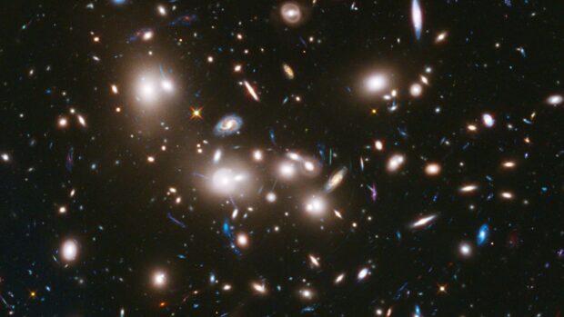 A vast cosmic scene showing the Hubble deep field galaxy cluster in space