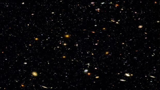 A vast galaxy field showing numerous distant galaxies captured in deep space