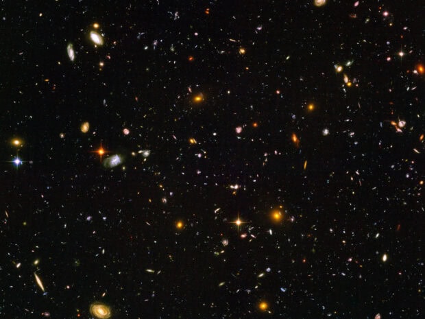 A vast view of deep space filled with distant galaxies in the Hubble Deep Field
