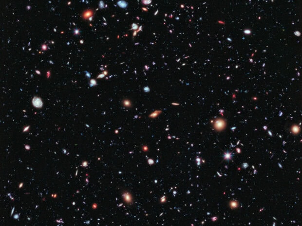 A detailed view of numerous distant galaxies captured in the Hubble Deep Field study
