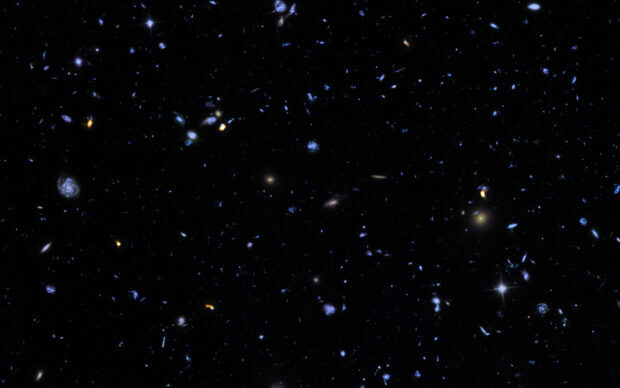 A detailed view of the Hubble Deep Field showing distant galaxies scattered across space