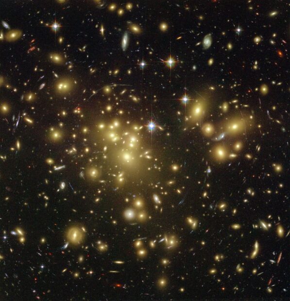 A detailed view of the Hubble deep field showing numerous distant galaxies and stars in space