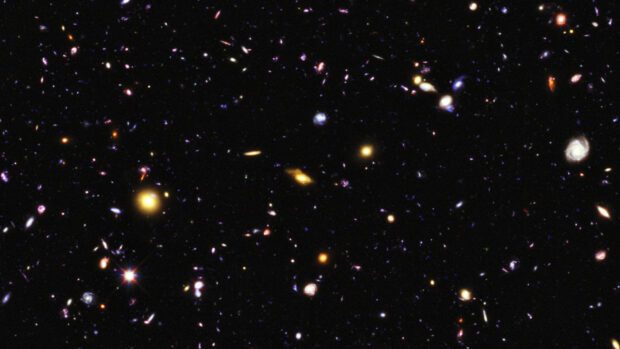 A deep field view showing distant galaxies and celestial objects in the Hubble Deep Field