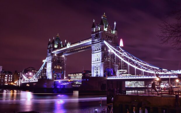 The United Kingdom Wallpapers showcase the glowing Tower Bridge over the River Thames at night, HD Desktop Wallpaper