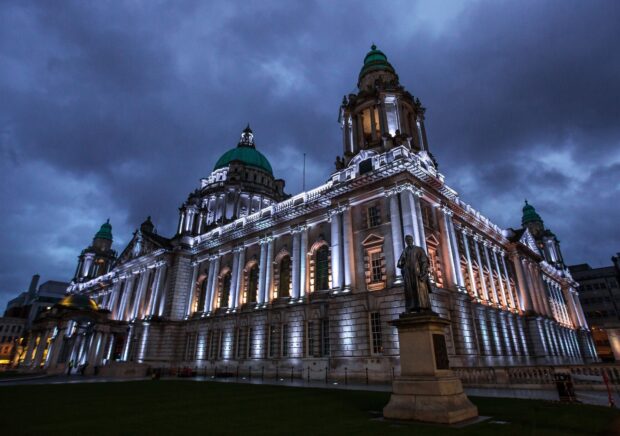 A grand historical building in Northern Ireland shines under a stormy sky in the evening, HD Desktop Wallpaper