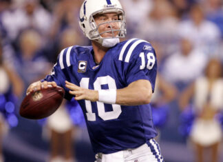 Indianapolis Colts player wearing number 18 preparing to throw the football during a game